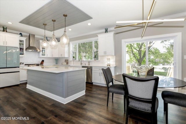 136 Lilac Dr, Brick, NJ 08724 - kitchen featuring light countertops, decorative backsplash, stainless steel appliances, and wall chimney exhaust hood