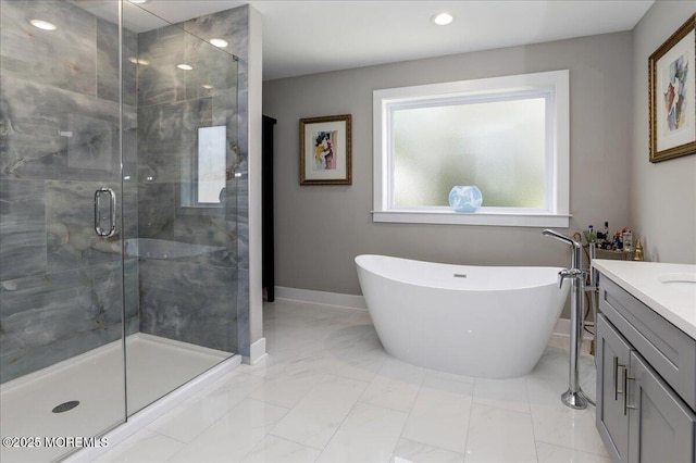136 Lilac Dr, Brick, NJ 08724 - bathroom featuring vanity, marble finish floor, baseboards, a soaking tub, and a shower stall