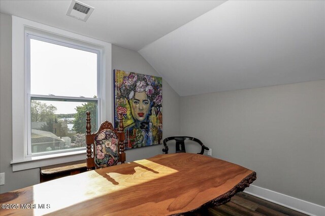 136 Lilac Dr, Brick, NJ 08724 - dining area featuring baseboards, lofted ceiling, wood finished floors, and visible vents