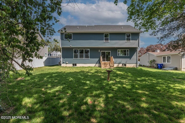 136 Lilac Dr, Brick, NJ 08724 - rear view of house featuring fence and a yard