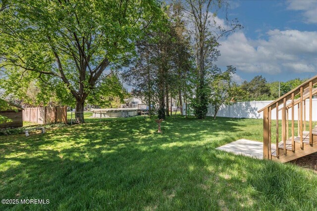 136 Lilac Dr, Brick, NJ 08724 - view of yard featuring a fenced backyard and a deck