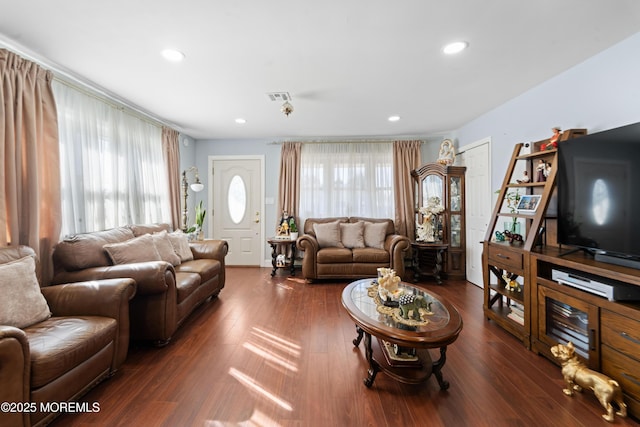 living area with recessed lighting, wood finished floors, visible vents, and plenty of natural light
