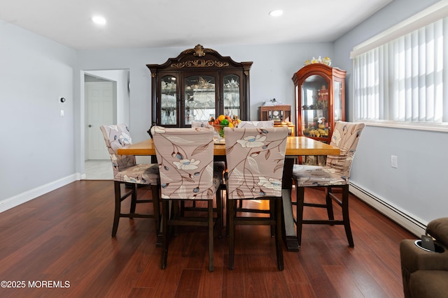 dining space featuring baseboard heating, baseboards, recessed lighting, and dark wood-style flooring