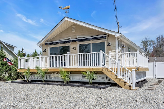 view of front of property with a deck and stairway