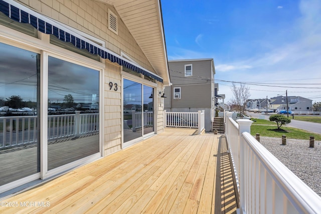 wooden terrace with a residential view