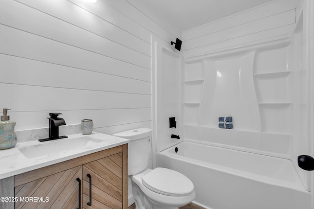bathroom featuring vanity, toilet, and tub / shower combination