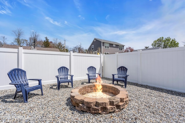 view of patio / terrace with a fire pit and a fenced backyard