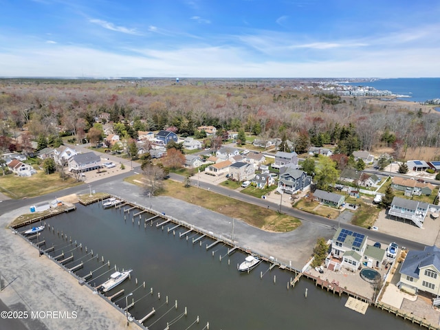 bird's eye view with a residential view and a water view
