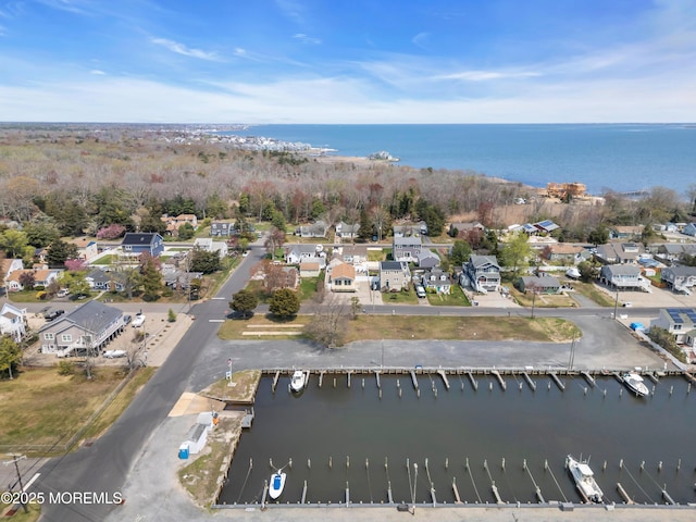 aerial view with a residential view and a water view