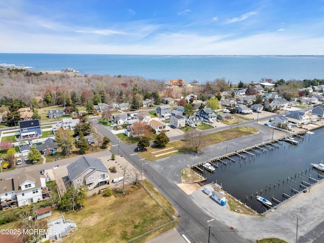 birds eye view of property with a residential view and a water view