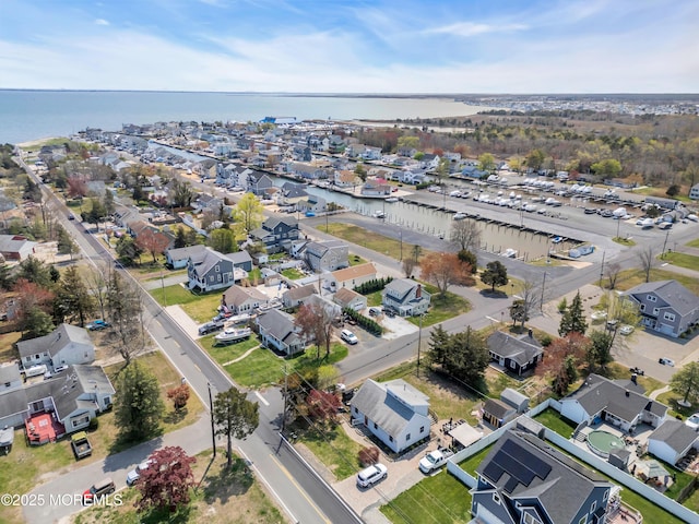 aerial view featuring a residential view and a water view