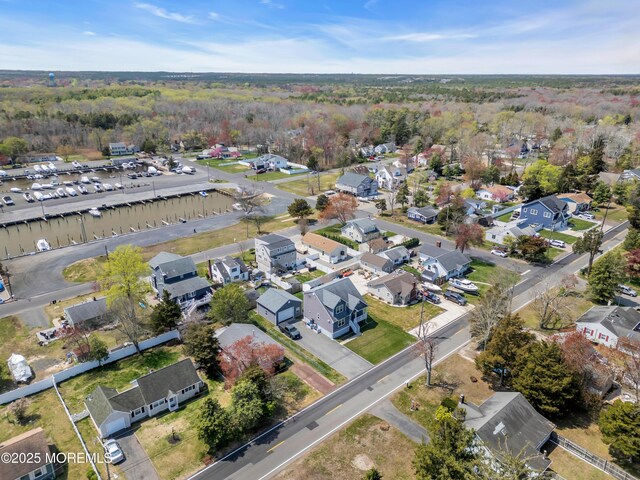 drone / aerial view with a view of trees and a residential view