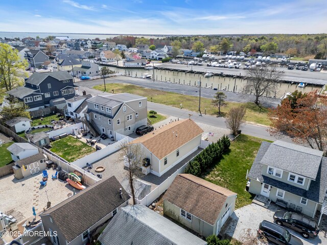aerial view with a residential view and a water view