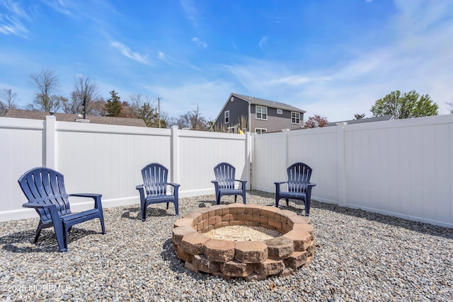 view of patio with a fire pit and a fenced backyard
