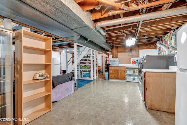 unfinished below grade area featuring light floors and stairway