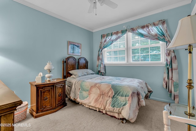 carpeted bedroom with ceiling fan, ornamental molding, and baseboards