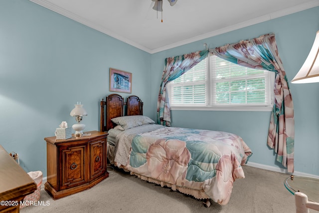 carpeted bedroom featuring baseboards, ornamental molding, and ceiling fan