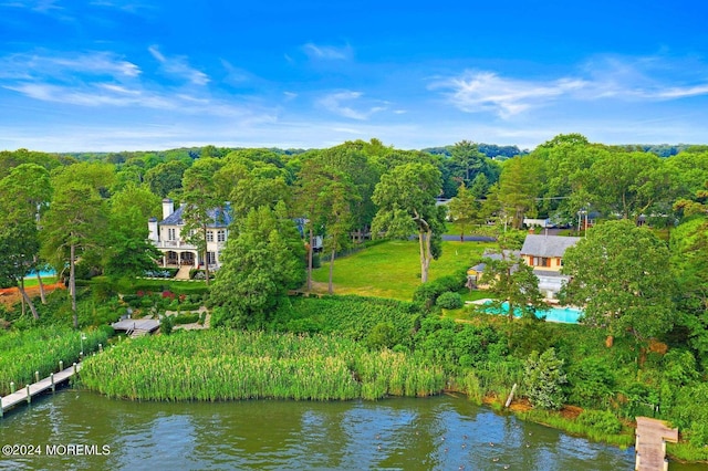 aerial view of property and surrounding area with a large body of water