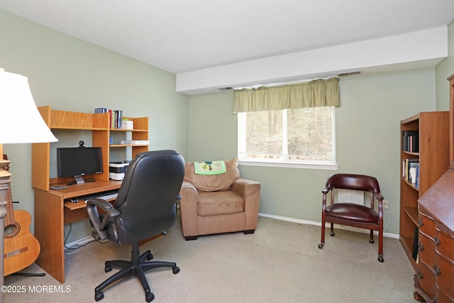 carpeted office space with baseboards