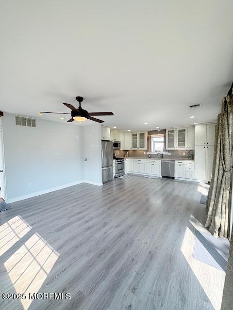 14 Jonathan Dr, Manahawkin, NJ 08050 - unfurnished living room with light wood-type flooring, recessed lighting, and a ceiling fan