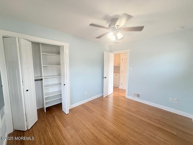 14 Jonathan Dr, Manahawkin, NJ 08050 - unfurnished bedroom featuring wood finished floors and a ceiling fan