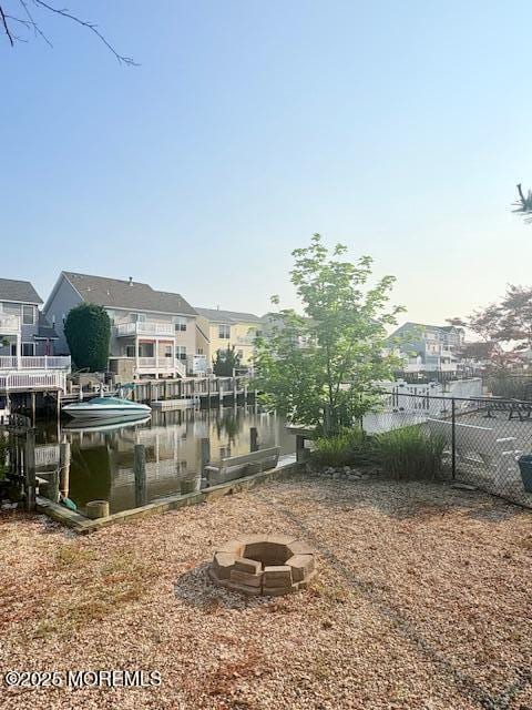 14 Jonathan Dr, Manahawkin, NJ 08050 - dock with an outdoor fire pit and a residential view
