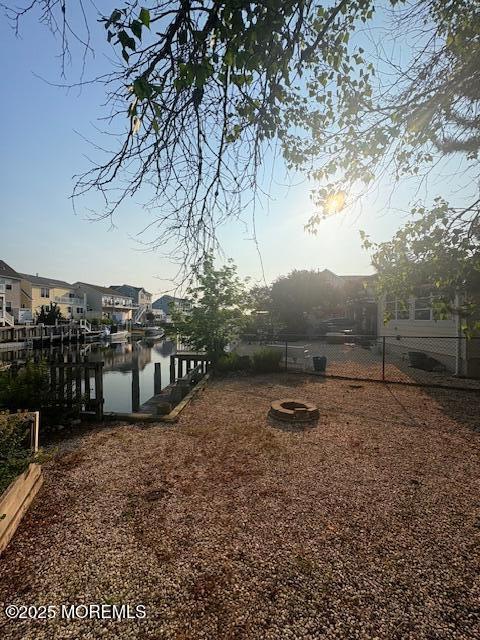 14 Jonathan Dr, Manahawkin, NJ 08050 - view of yard featuring a water view and a boat dock