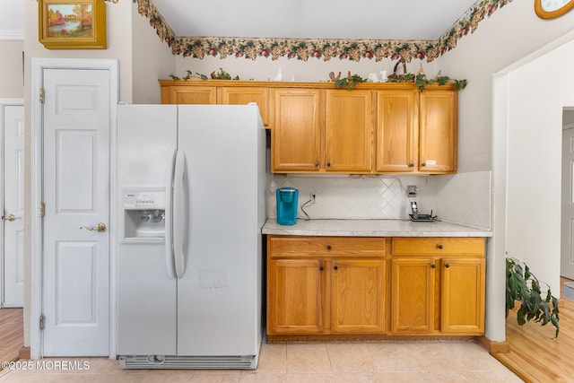 87 Halsted Dr, Manchester, NJ 08759 - kitchen with light countertops, white refrigerator with ice dispenser, backsplash, and brown cabinetry