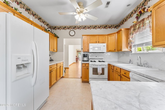 87 Halsted Dr, Manchester, NJ 08759 - kitchen with visible vents, a sink, white appliances, and light countertops