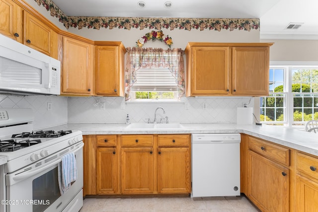 87 Halsted Dr, Manchester, NJ 08759 - kitchen with white appliances, visible vents, a sink, and light countertops