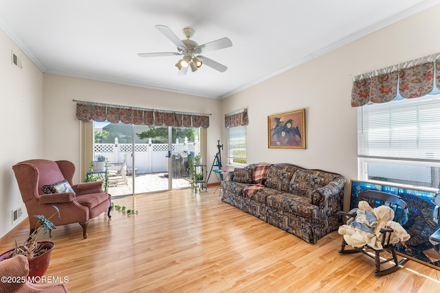87 Halsted Dr, Manchester, NJ 08759 - living room featuring visible vents, a ceiling fan, crown molding, and wood finished floors