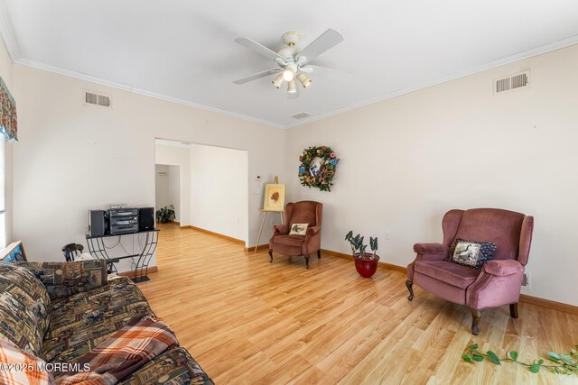 87 Halsted Dr, Manchester, NJ 08759 - living area featuring visible vents, ornamental molding, and wood finished floors