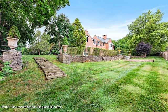 view of yard with fence