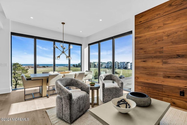dining space featuring wood finished floors, plenty of natural light, and recessed lighting