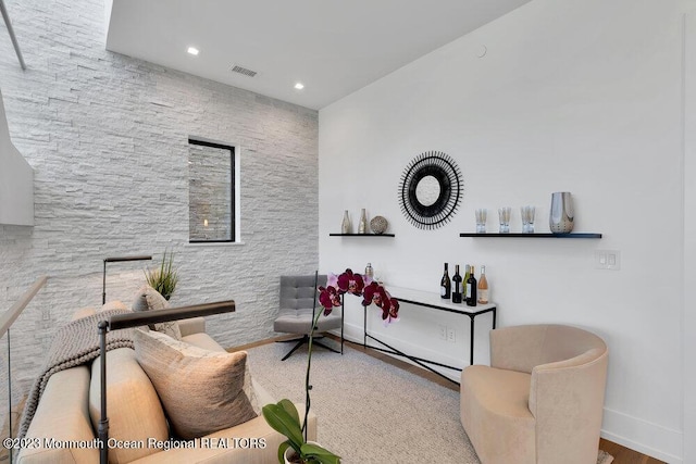 sitting room with baseboards, visible vents, and recessed lighting