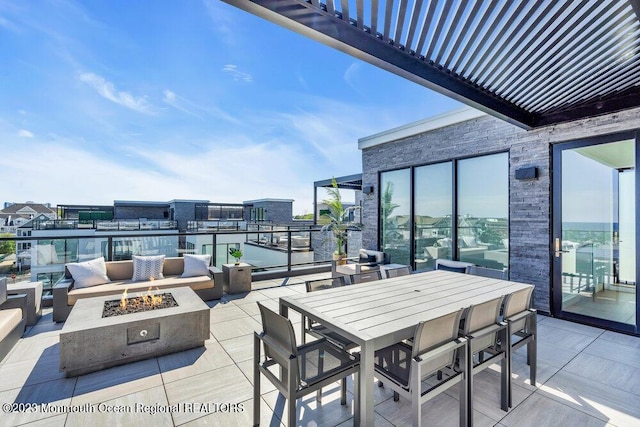 view of patio / terrace with a fire pit
