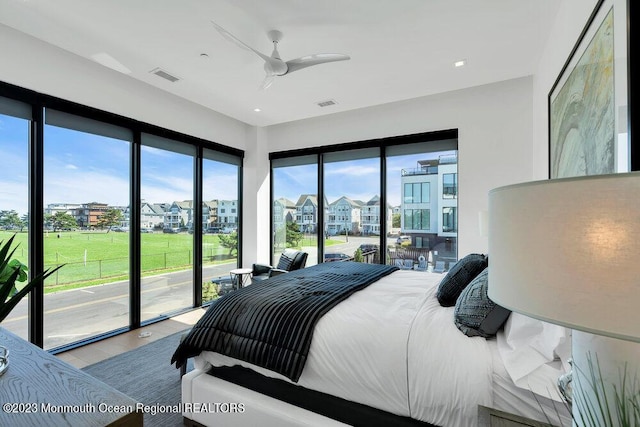 bedroom featuring visible vents, access to outside, and multiple windows