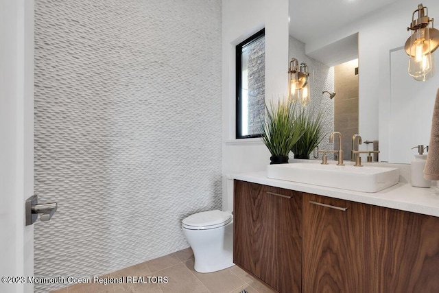 full bathroom featuring vanity, toilet, and tile patterned flooring
