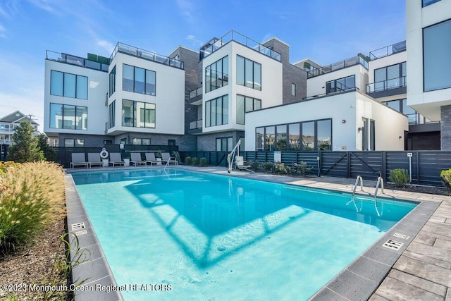 community pool featuring fence