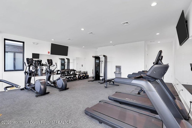 exercise room with visible vents and recessed lighting