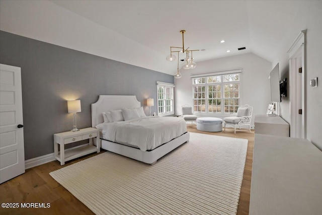 bedroom featuring wood finished floors, recessed lighting, vaulted ceiling, and baseboards