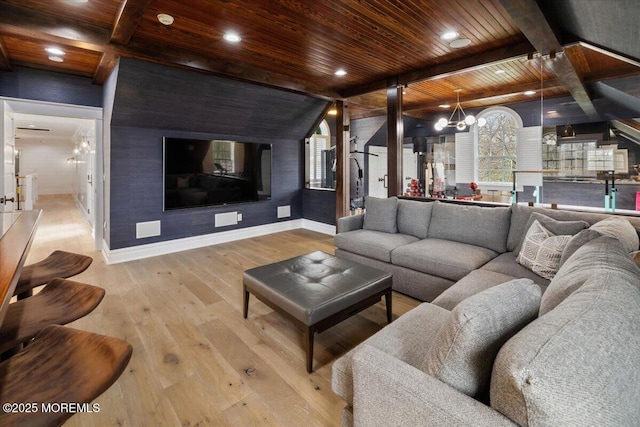 living area with wooden ceiling, hardwood / wood-style floors, beamed ceiling, baseboards, and a notable chandelier