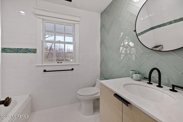 full bath with tile patterned flooring, tile walls, toilet, and vanity