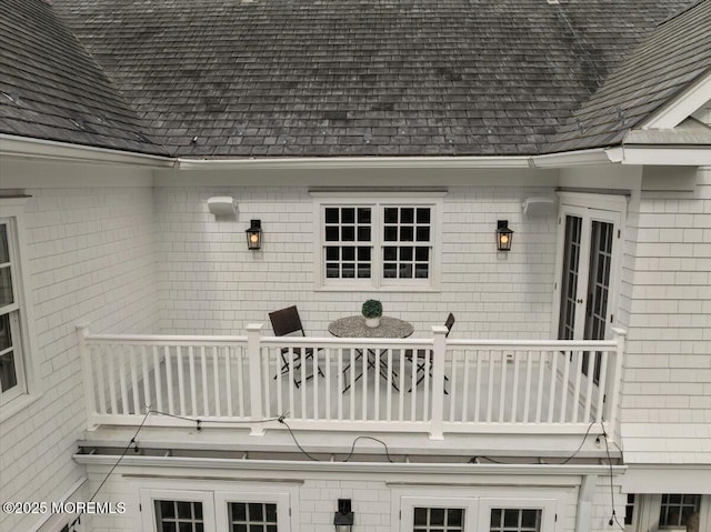 exterior space with french doors and a balcony