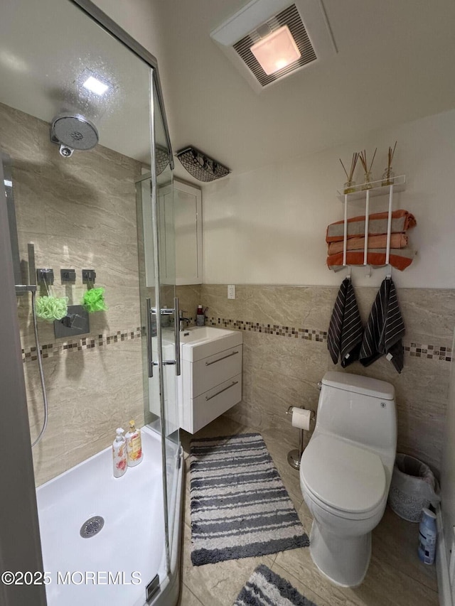 12 Yates Ave, South River, NJ 08882 - bathroom with tile walls, a shower stall, vanity, and wainscoting