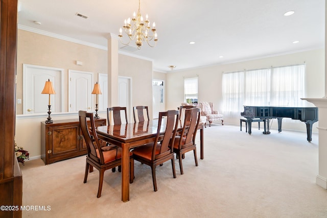 dining space with visible vents, a notable chandelier, crown molding, and light colored carpet
