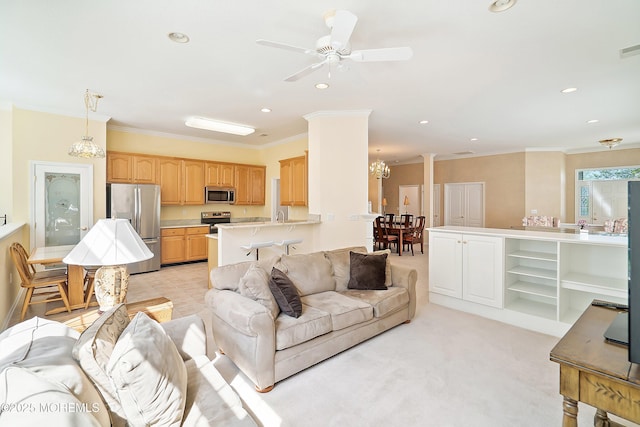 living area with visible vents, recessed lighting, ornamental molding, and ceiling fan with notable chandelier