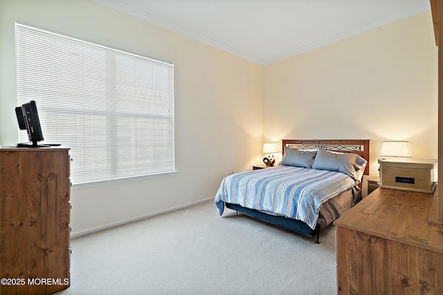 bedroom featuring carpet, ornamental molding, and baseboards