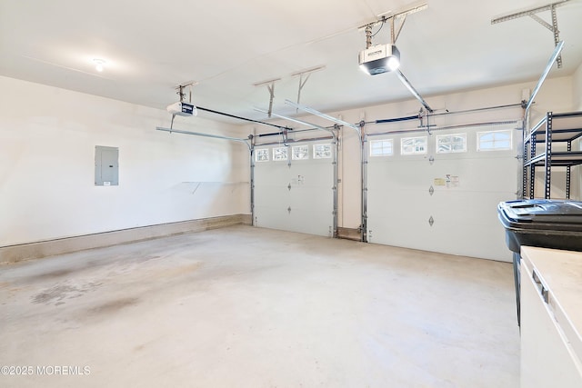 garage featuring electric panel and a garage door opener