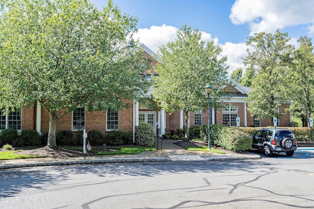 view of front of home featuring brick siding
